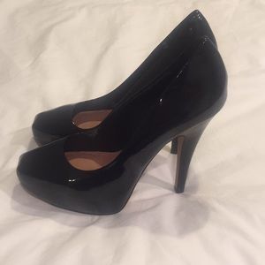 Black patent leather pumps
